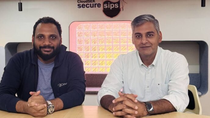 Rama Krishna Gudipati with CloudSEK CEO Rahul Sasi at CloudSEK's cafe, SecureSips, discussing future strategies for customer success and cybersecurity excellence.